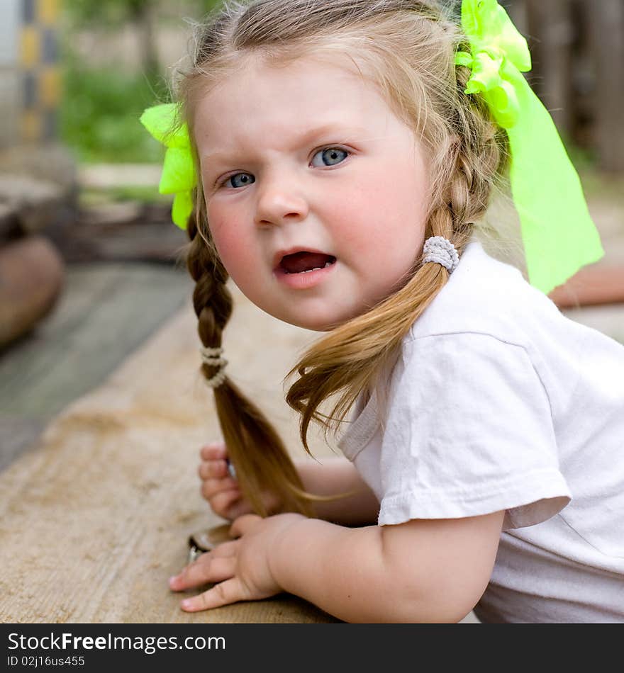 Little girl playing in the garden