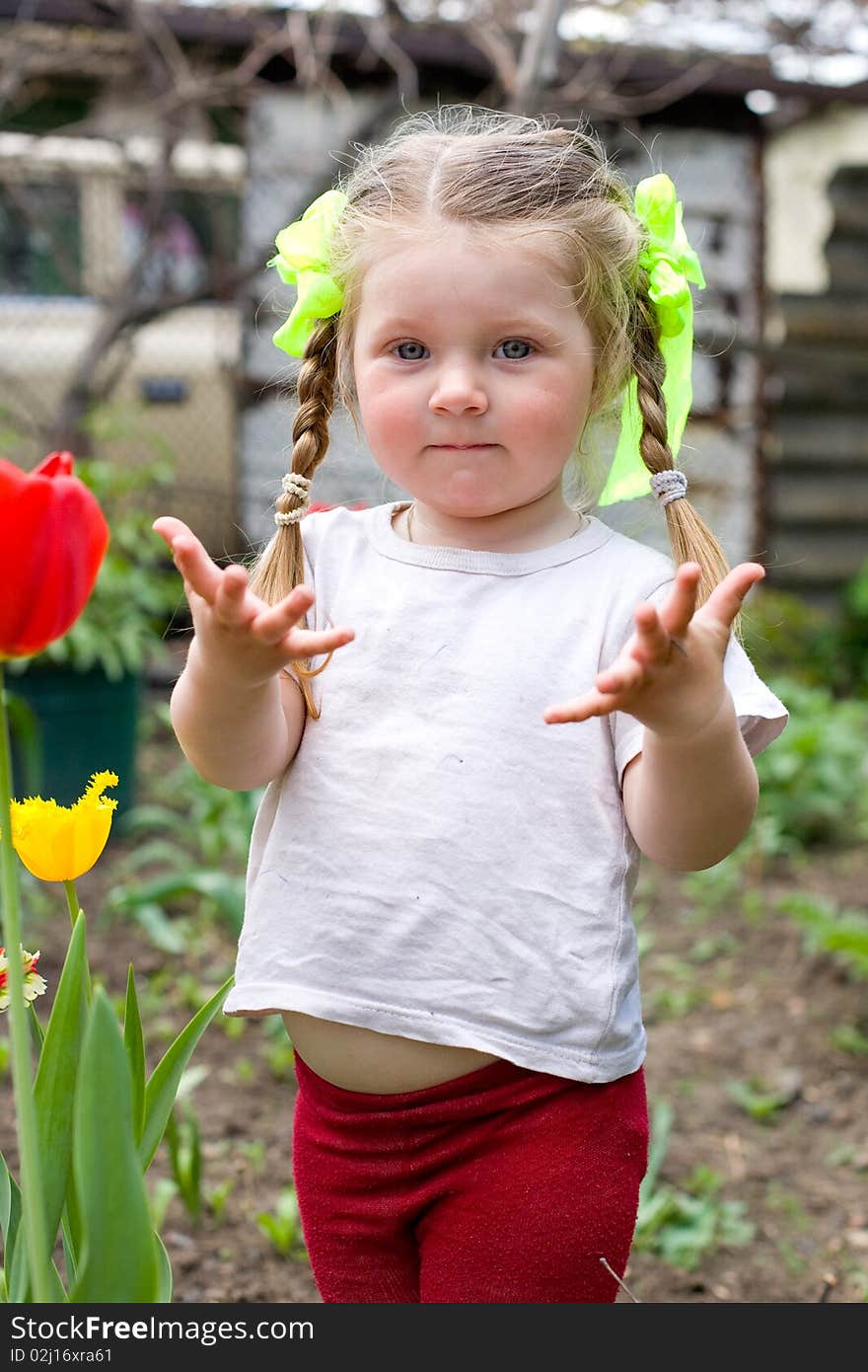 Little girl playing in the garden