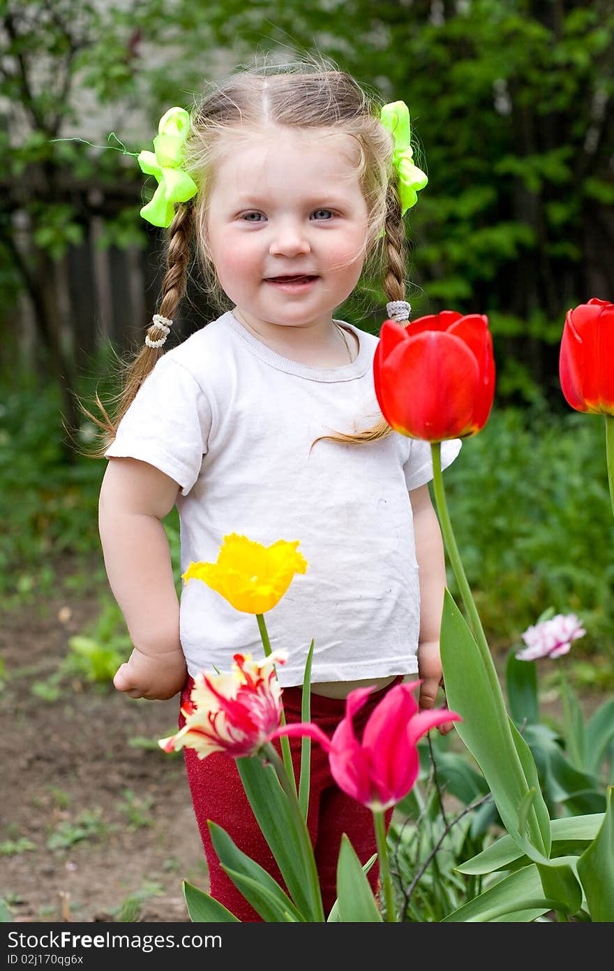 Little girl playing in the garden