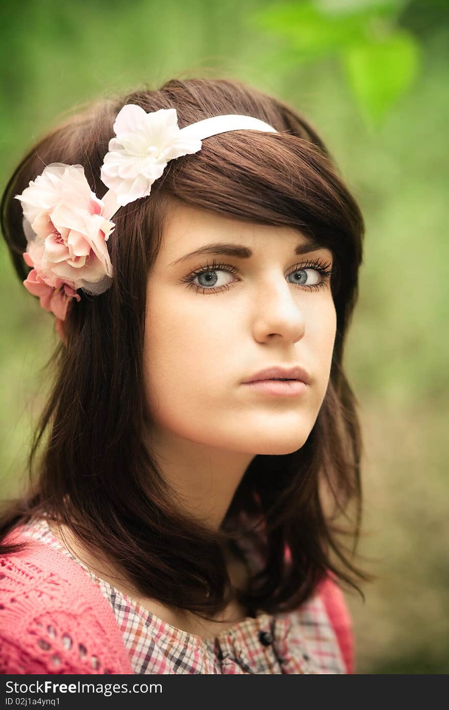 Young pretty girl with dark hair outdoor portrait. Young pretty girl with dark hair outdoor portrait