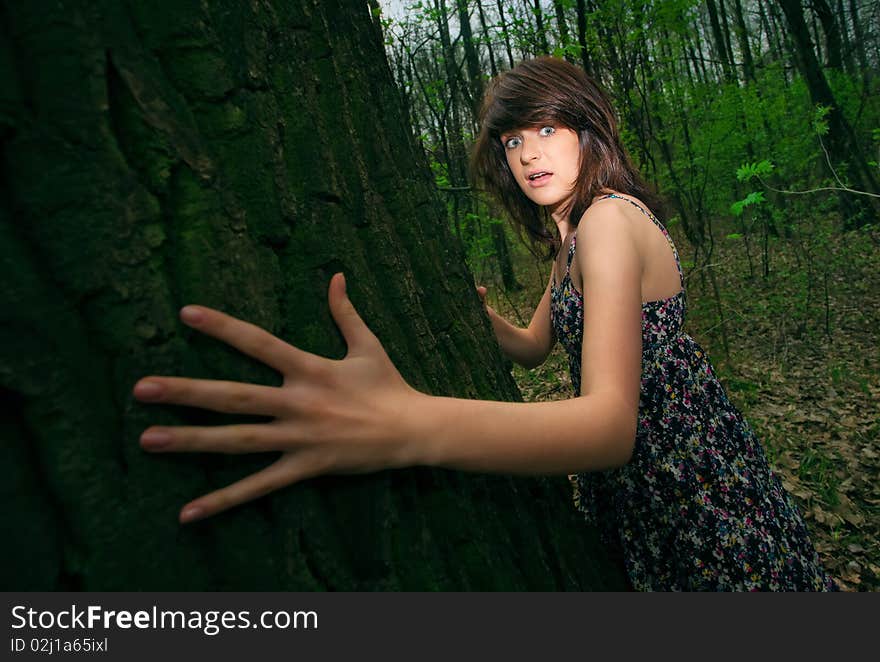 Young pretty girl in the forest