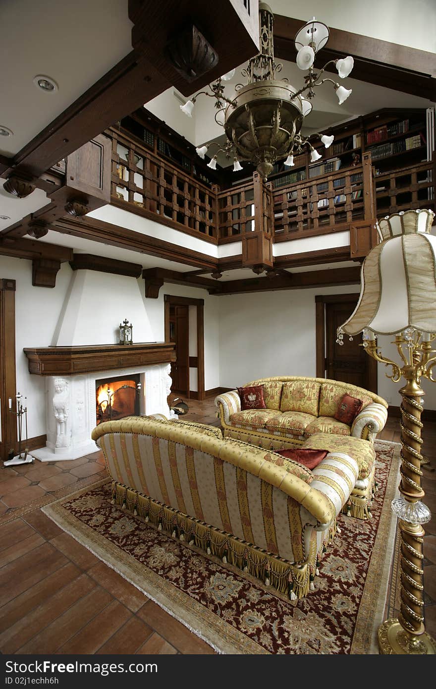 Interior of a living room with fireplace and stair