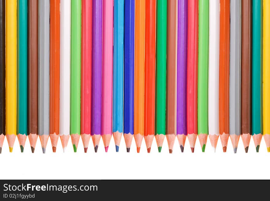 Row of bright color pencils isolated on white