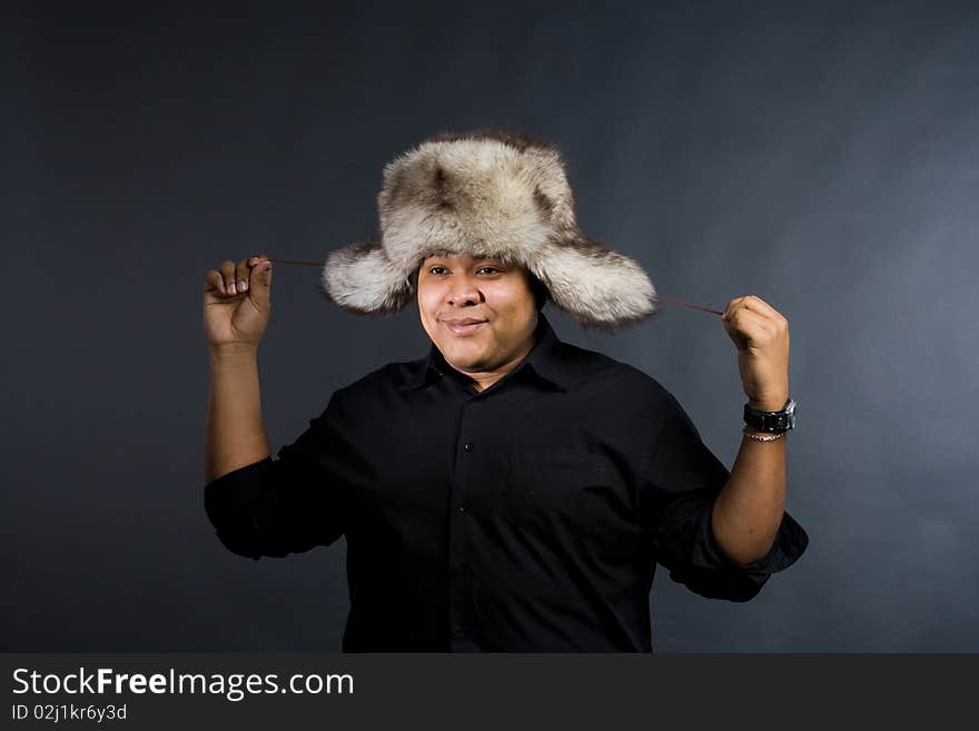 Young man with grey fur hat. Young man with grey fur hat