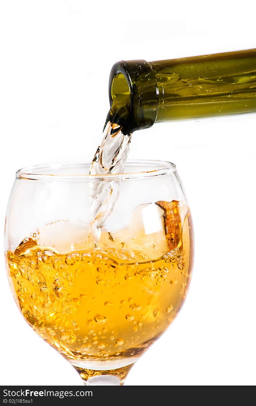 White wine pouring down from a wine bottle against white background