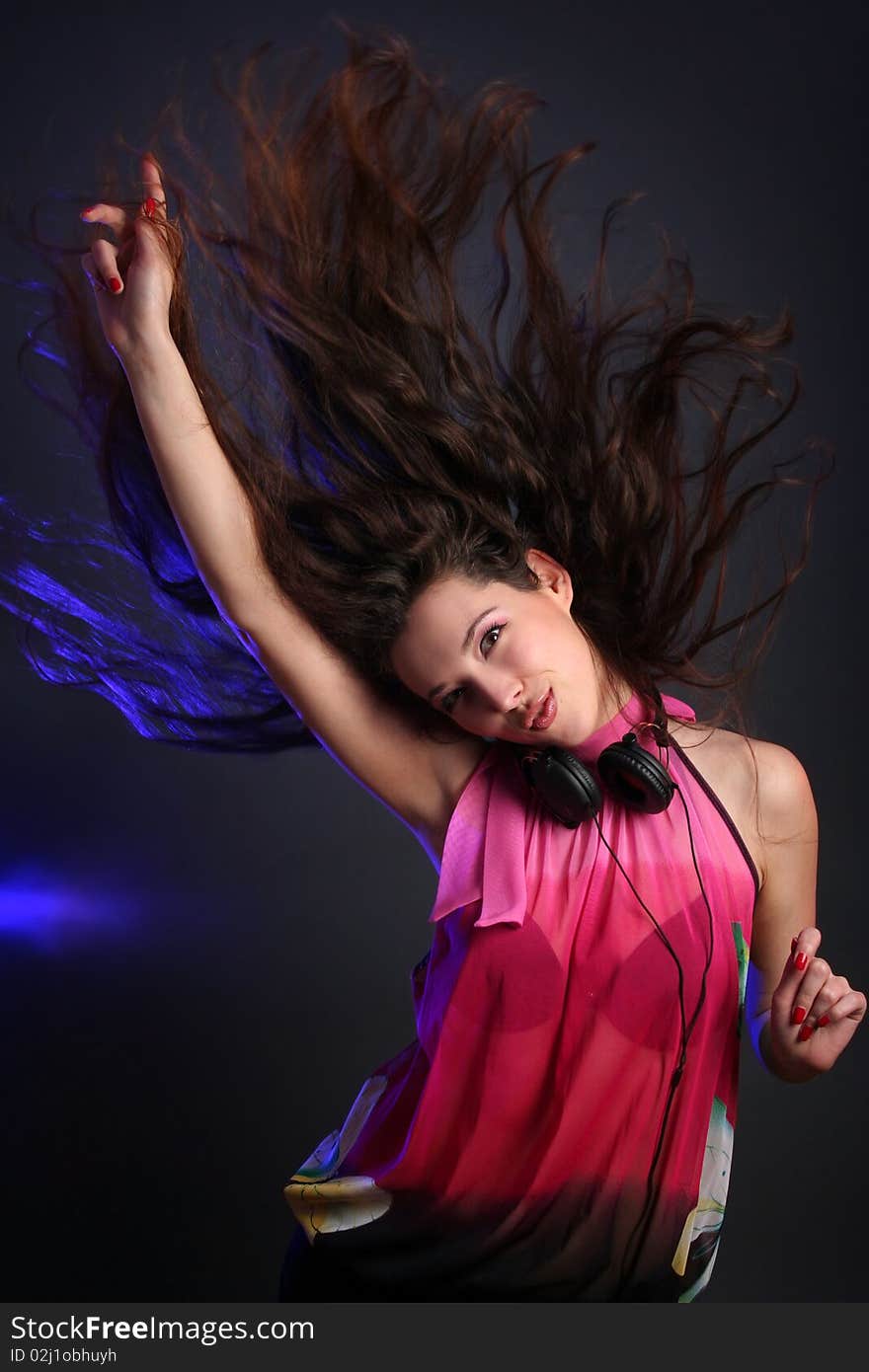 young woman dancing with headphones. young woman dancing with headphones