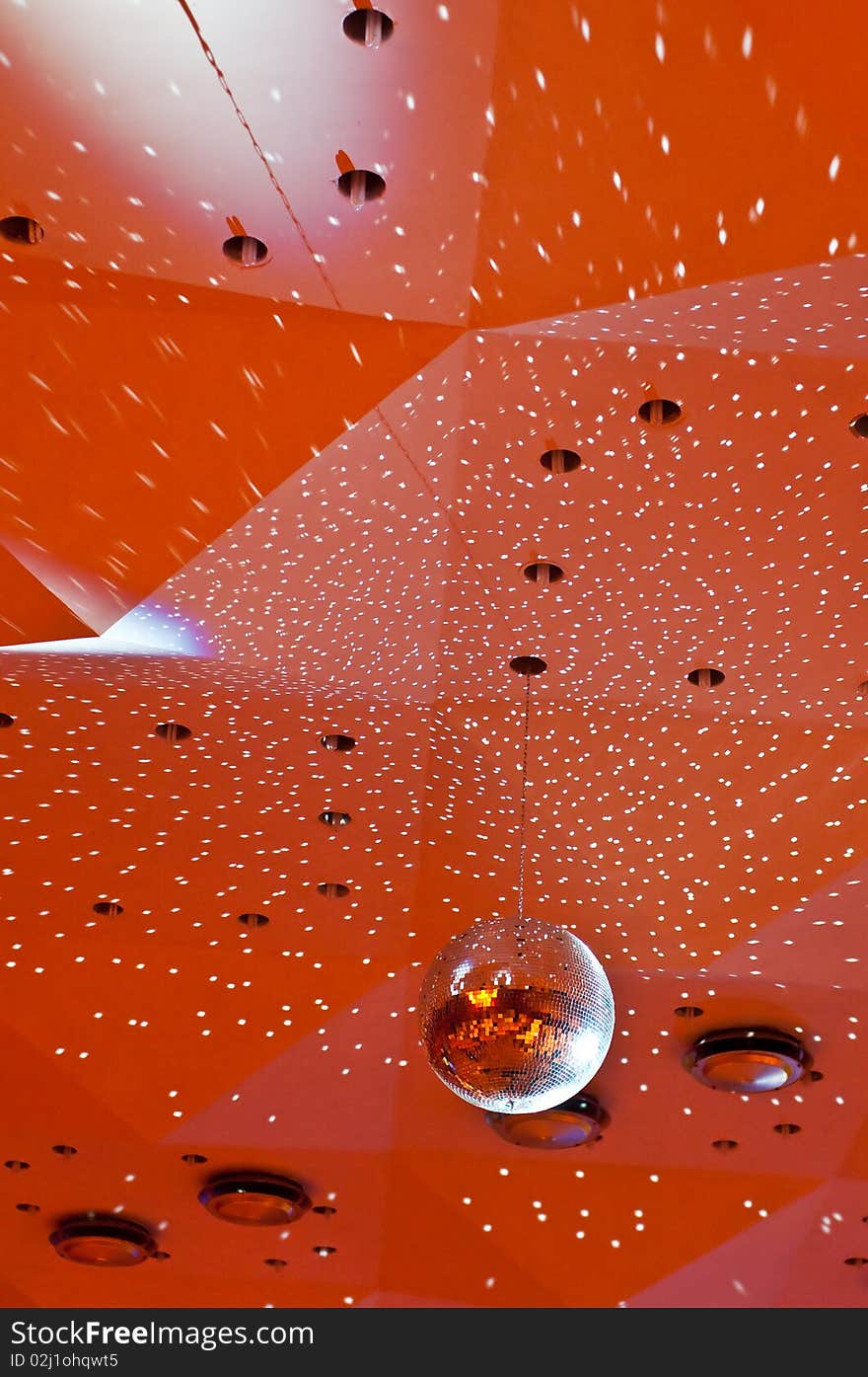 Vertical photo of a disco ceiling with disco-ball and small light reflections,. Vertical photo of a disco ceiling with disco-ball and small light reflections,