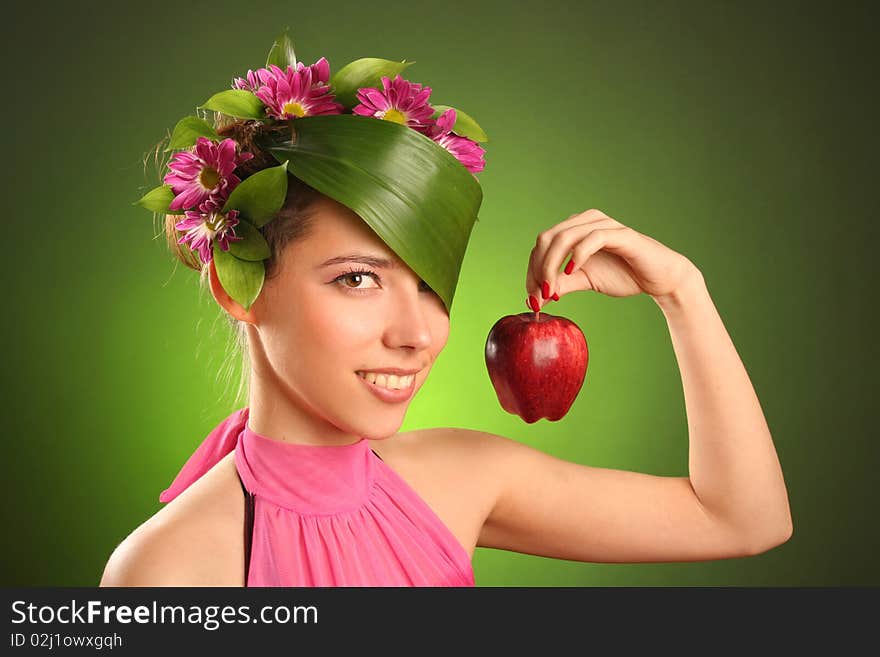 Beautiful spring-woman with red apple