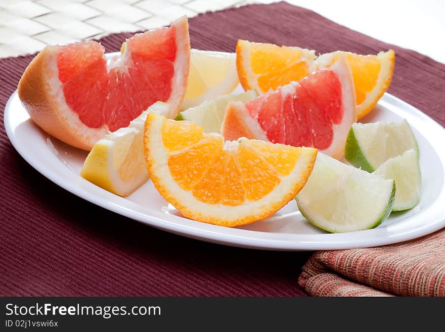 Arrangement of lemon, lime, tangerine, orange and grapefruit fruit. Arrangement of lemon, lime, tangerine, orange and grapefruit fruit