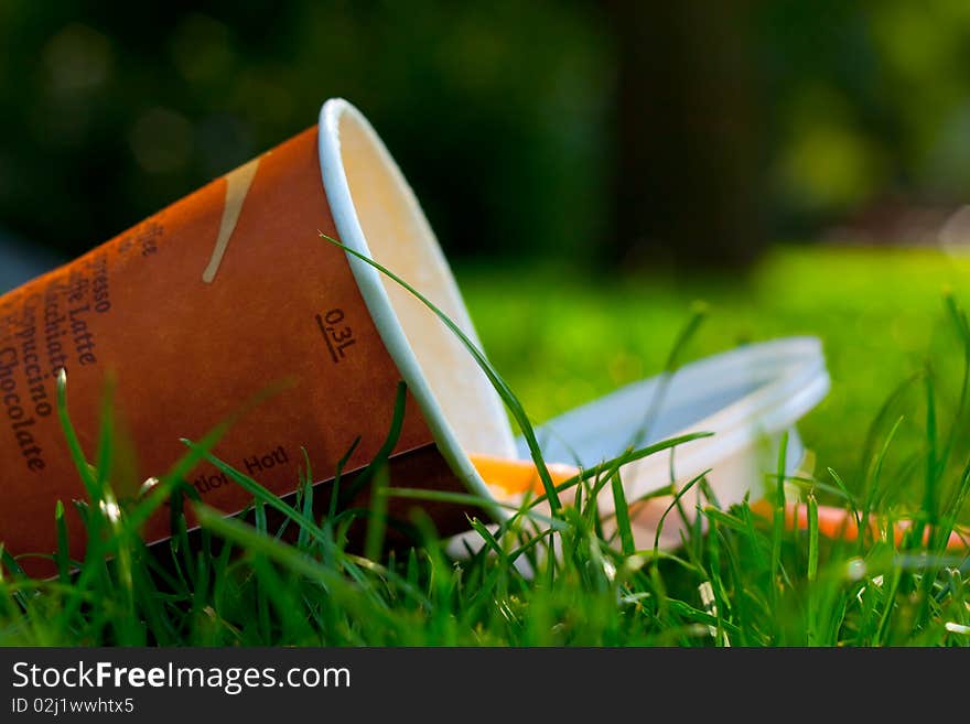 Forgotten empty drink on the grass