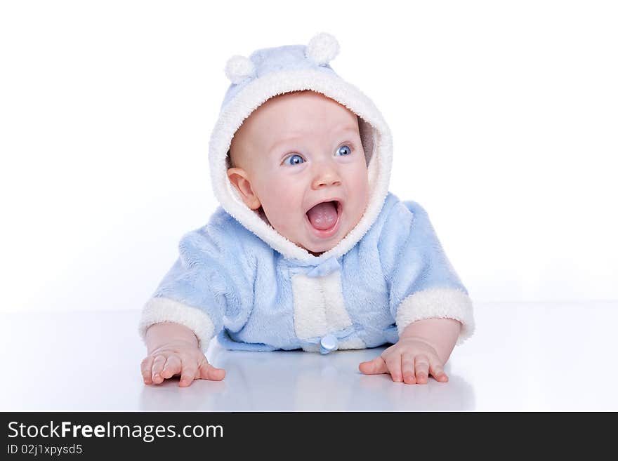 Cute little boy with a warm coat on white background