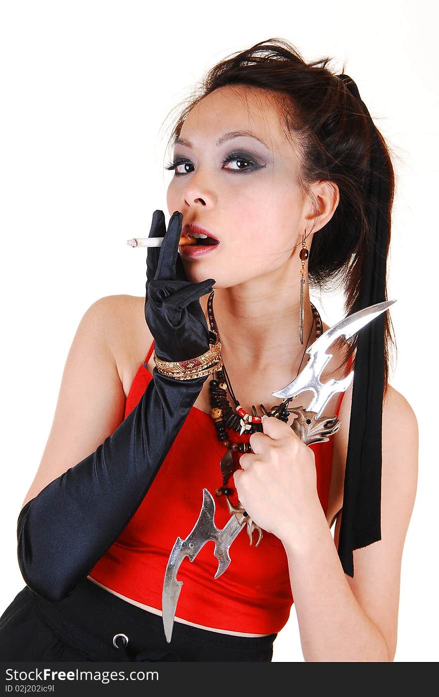 Pretty Asian pirate girl with black cloves and a cigarette in her hand and a sword with a red top and black skirt, for white background. Pretty Asian pirate girl with black cloves and a cigarette in her hand and a sword with a red top and black skirt, for white background.