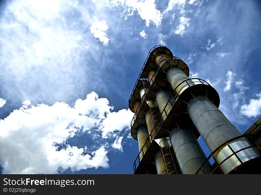 Factory Stacks And Blue Sky