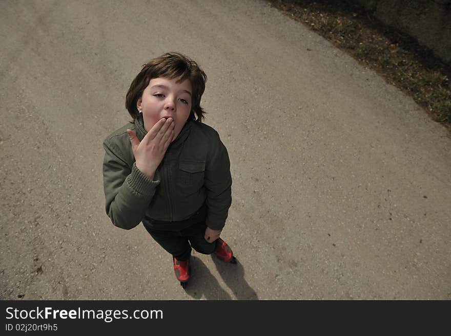 Happy young girl relax and drive rollerblade skates outdoor. Happy young girl relax and drive rollerblade skates outdoor