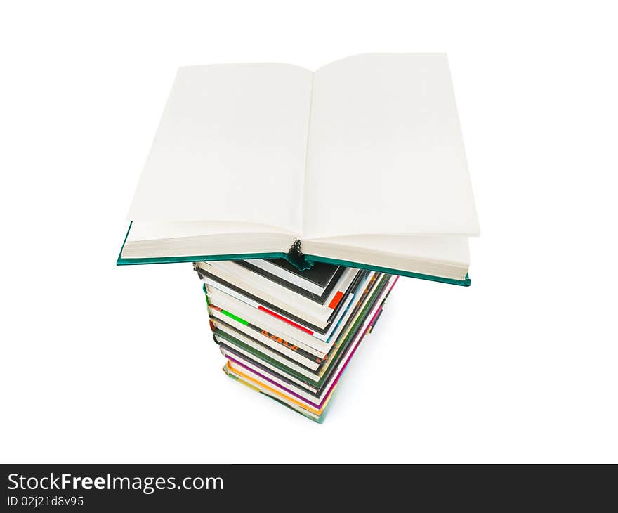 Opened book on stack isolated on white background