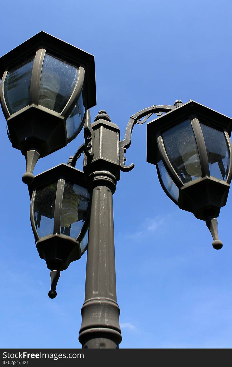 Lamp post under the blue sky