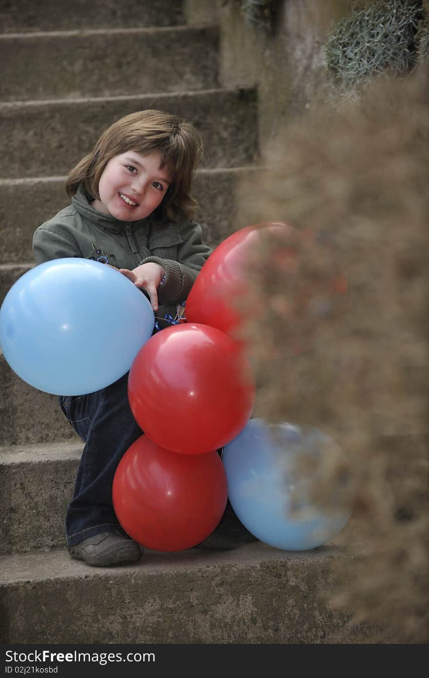 Girl with balloons outdoor