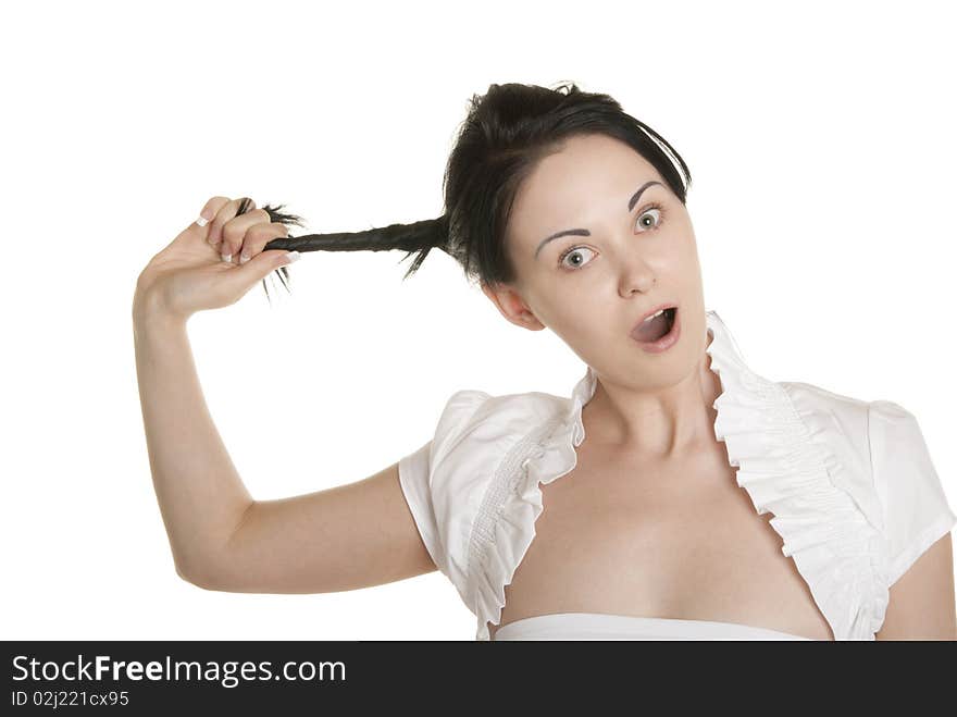 Young woman pulls itself for plait