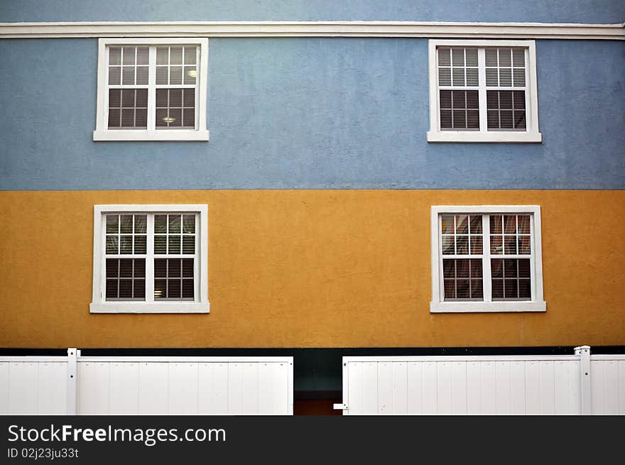 Colorful building with white window frame. Colorful building with white window frame