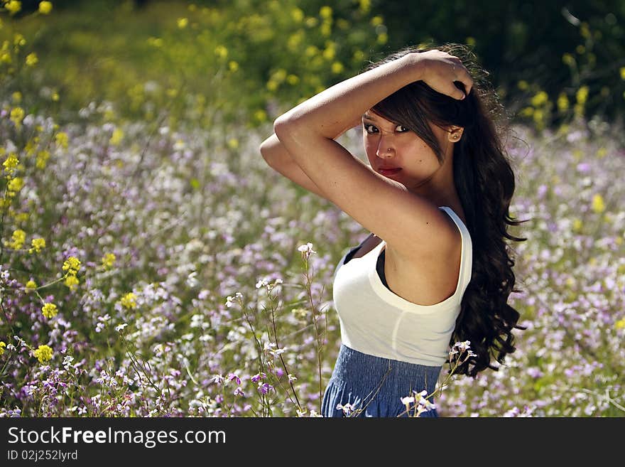 Japanese-Hawaiian female in field of wildflowers. Japanese-Hawaiian female in field of wildflowers