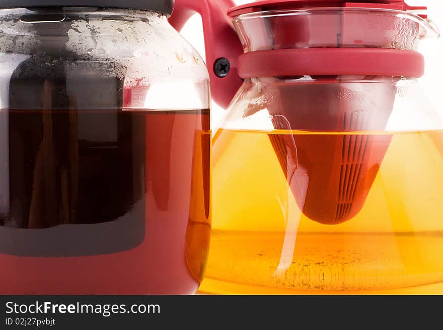 Series. A glass teapot isolated on a white background. Green and black tea