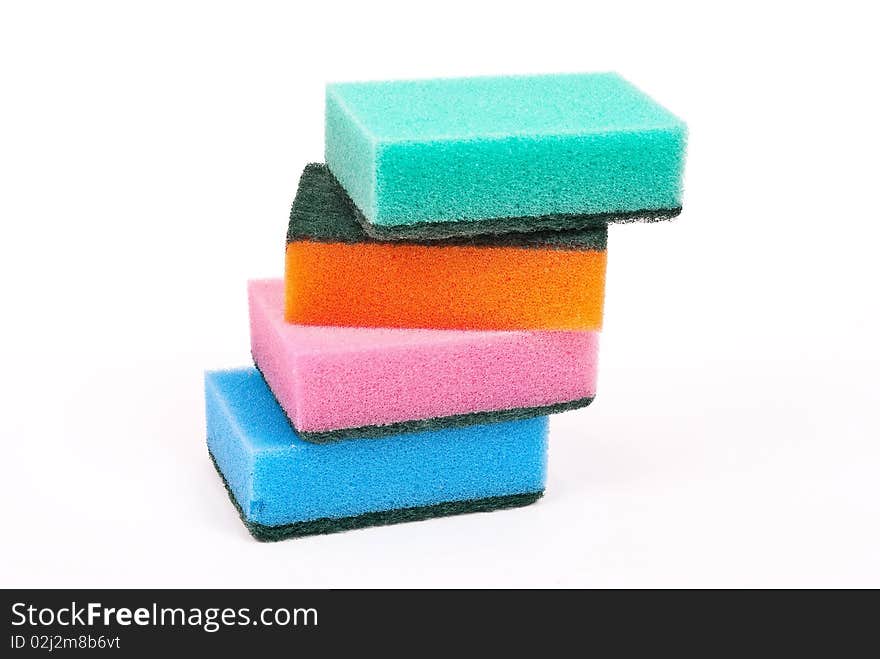 Multi-coloured kitchen sponges on white