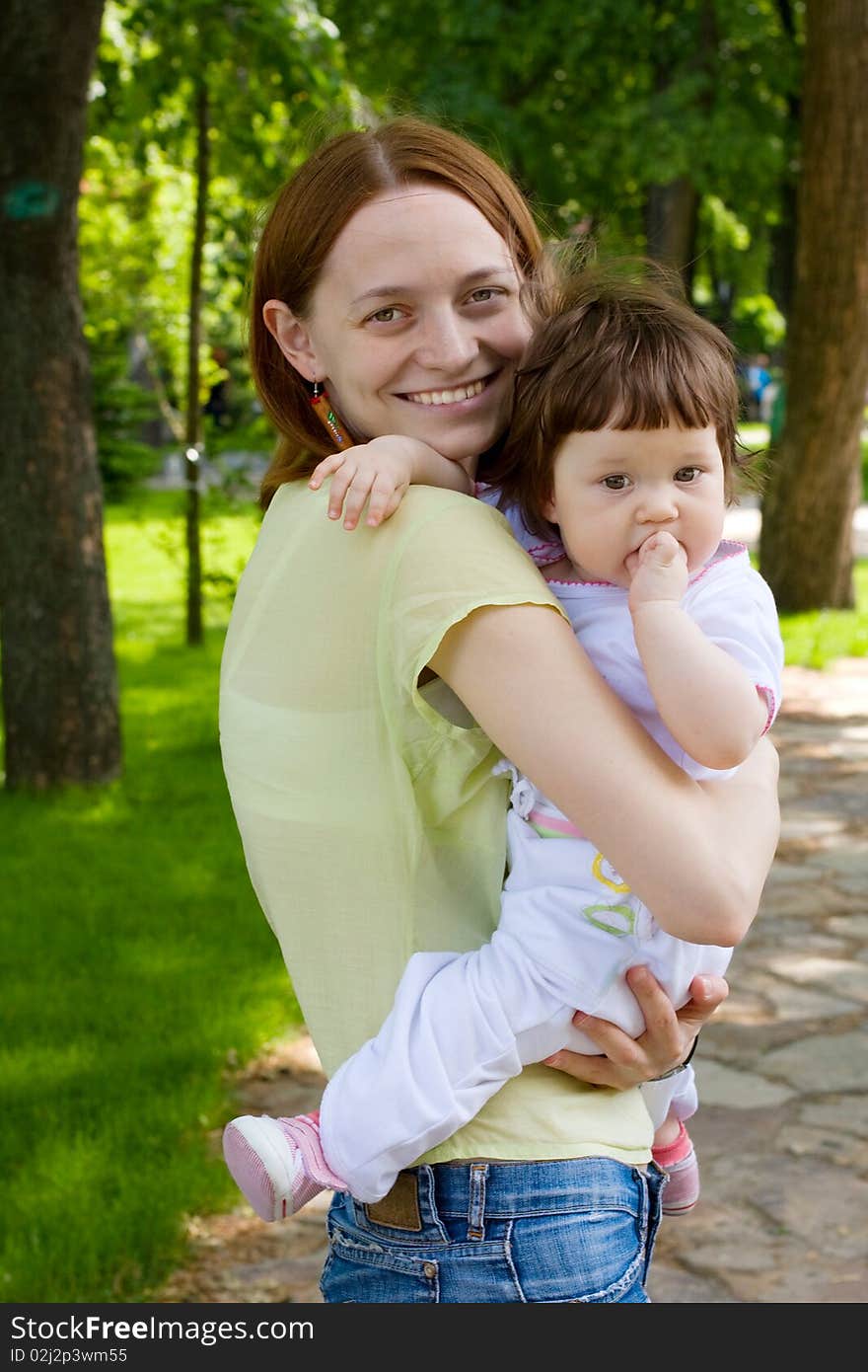 Mother and daughter in park. Mother and daughter in park