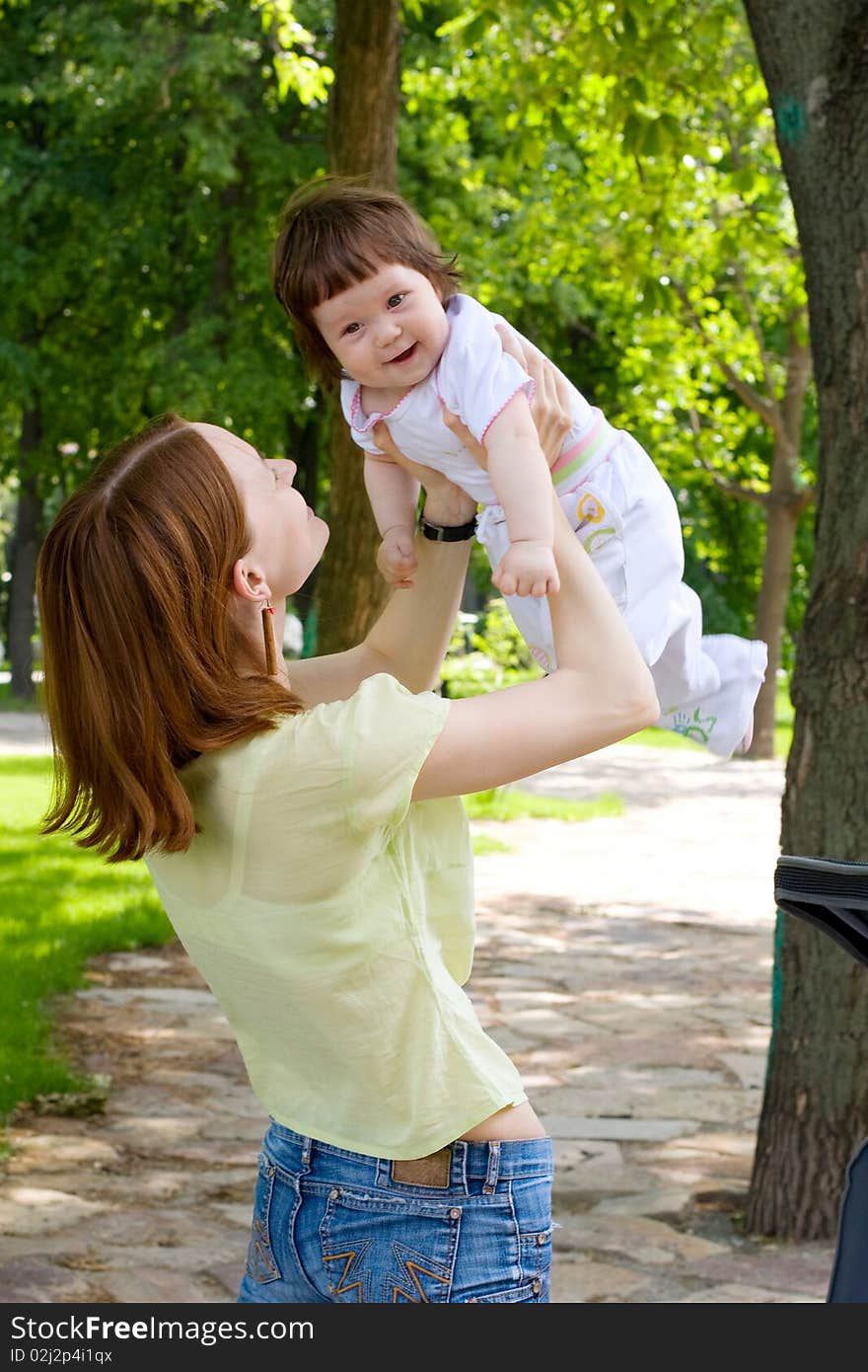 Mother and daughter in park. Mother and daughter in park