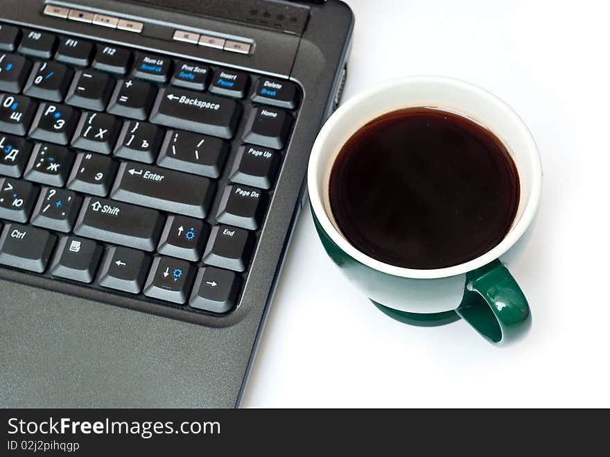 Fresh hot coffe and black notebook isolated on white. Focus on cup. Fresh hot coffe and black notebook isolated on white. Focus on cup