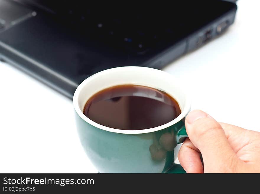 Fresh hot coffe and black notebook isolated on white. Focus on cup. Fresh hot coffe and black notebook isolated on white. Focus on cup