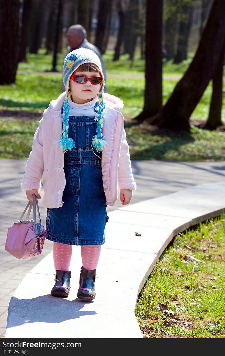 Child take a wolk in park