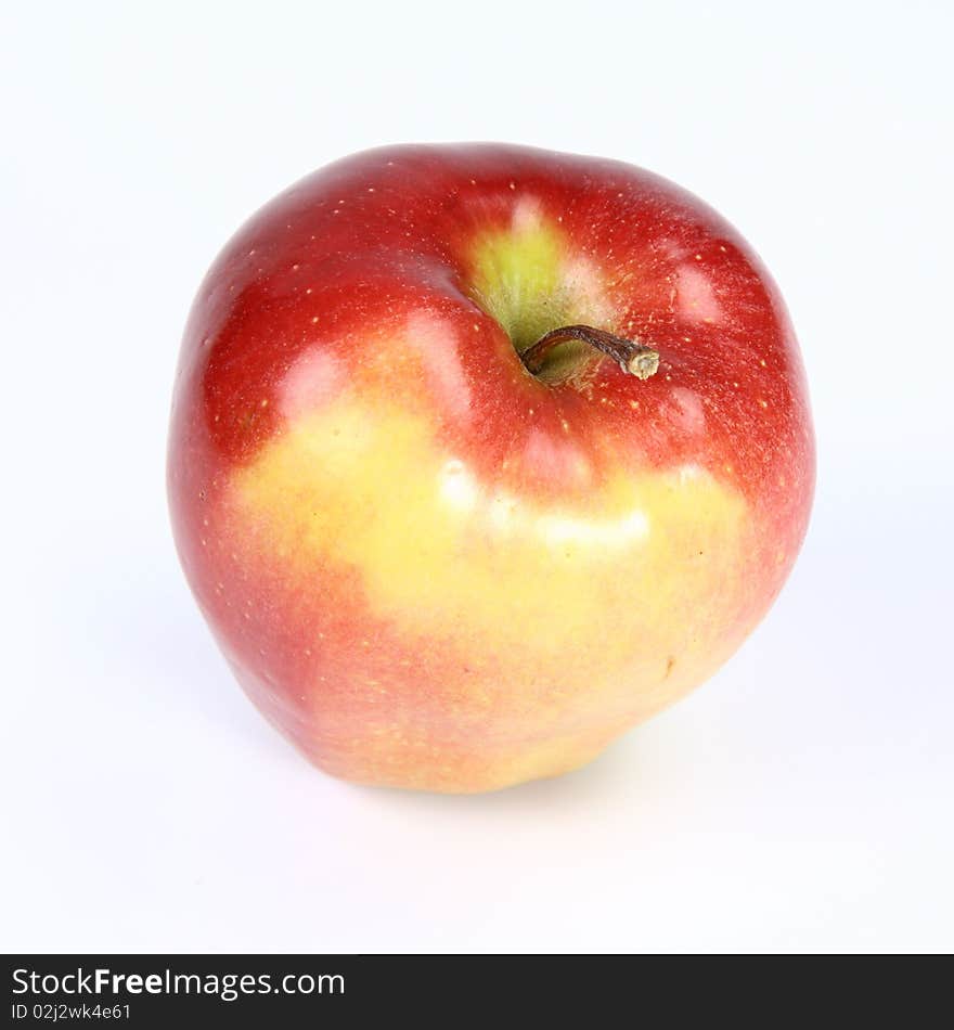 Red and yellow apple on white background