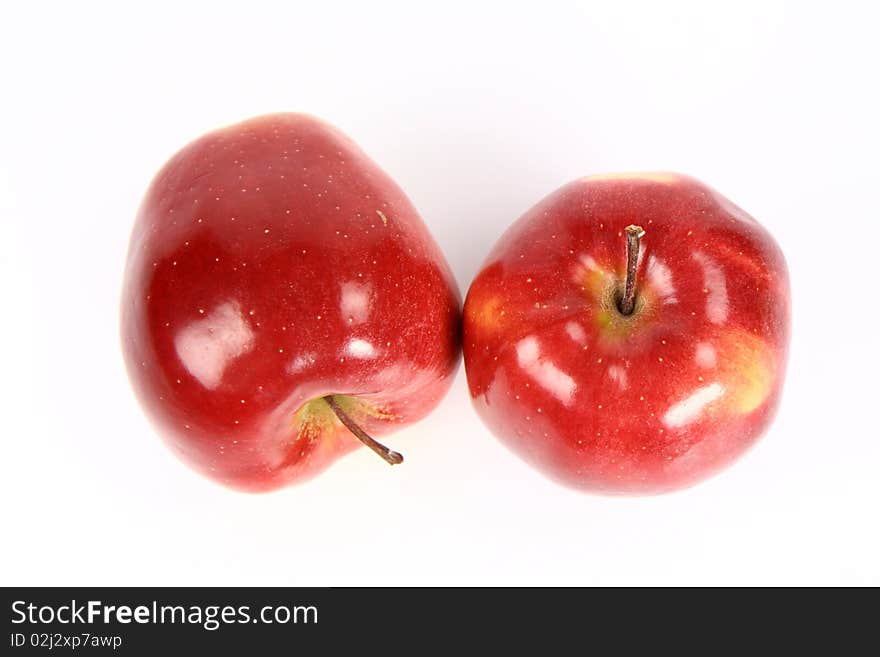 Two red apples on white background