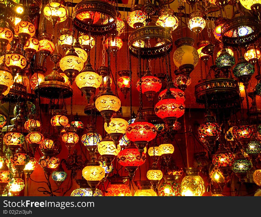 Different colourful lamps hanging from the ceiling