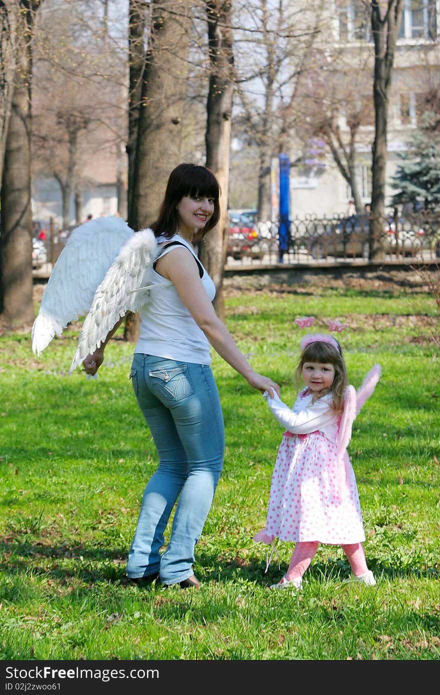 Young girl and mother with wings