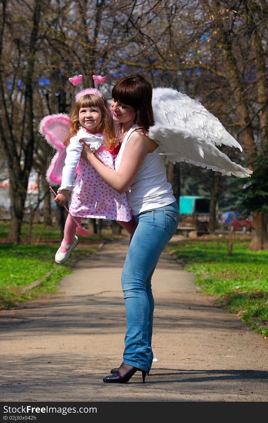 Young girl and mother with wings