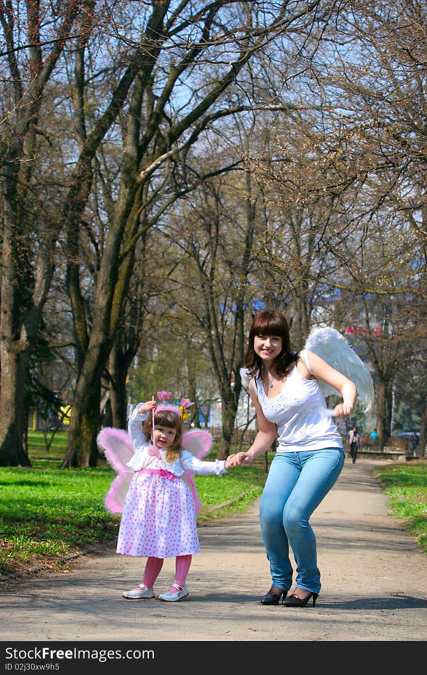 Young girl and mother with wings