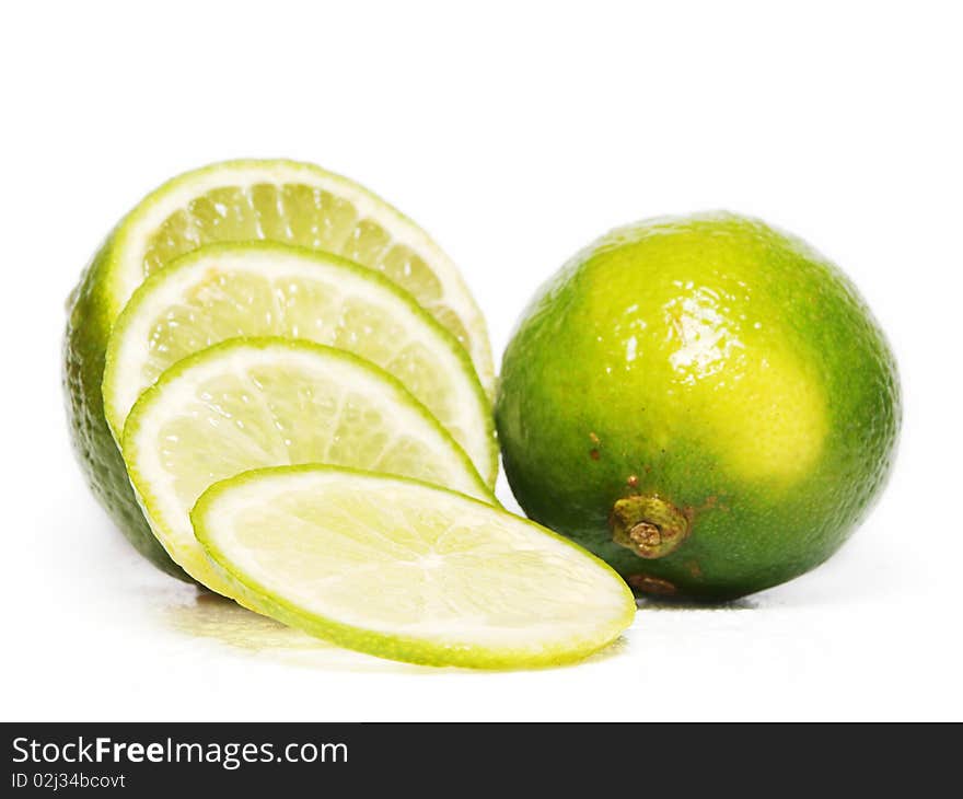 Fresh green lime fruit towards white background