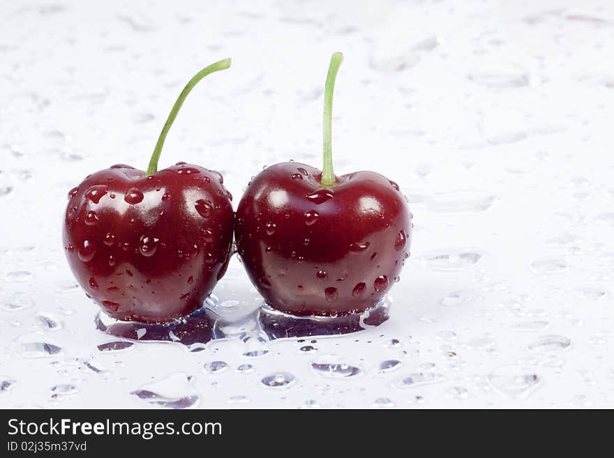 Two cherries on white background. Two cherries on white background