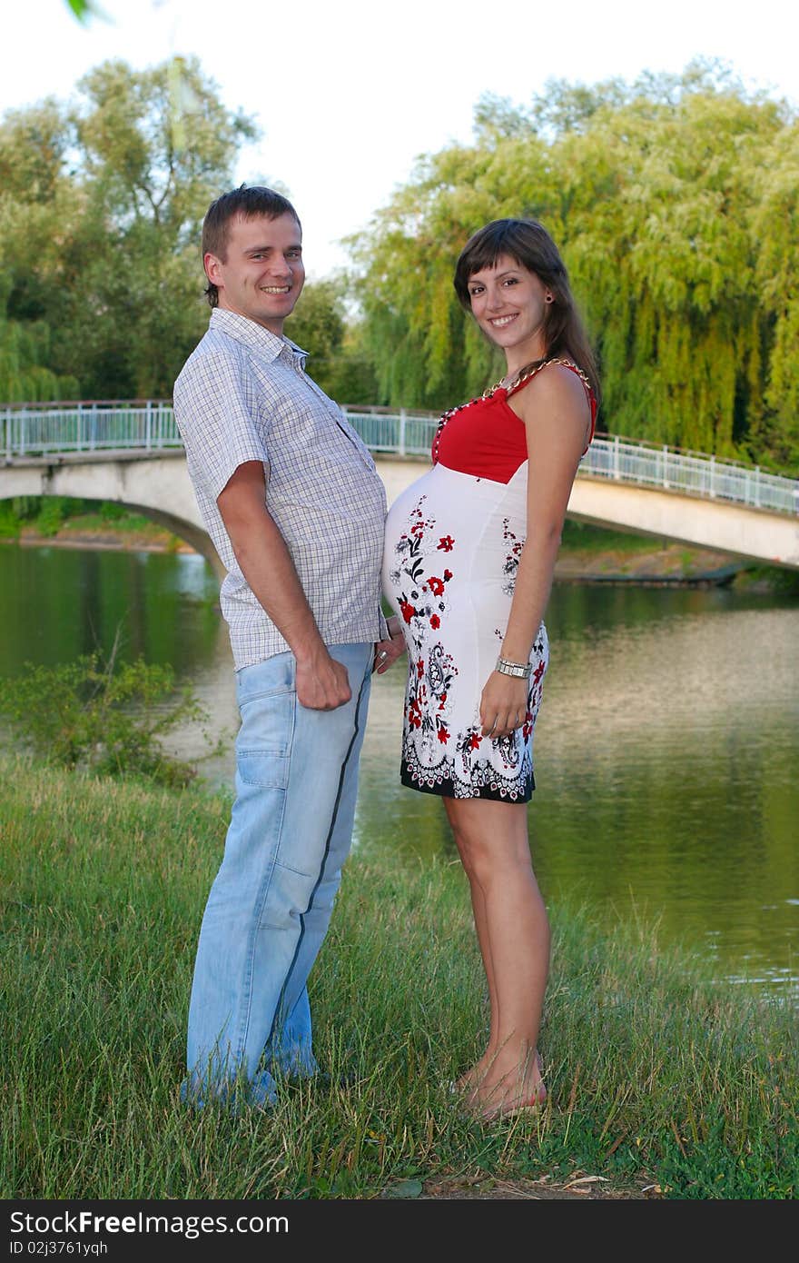 Happy pregnant woman with husband. Happy pregnant woman with husband