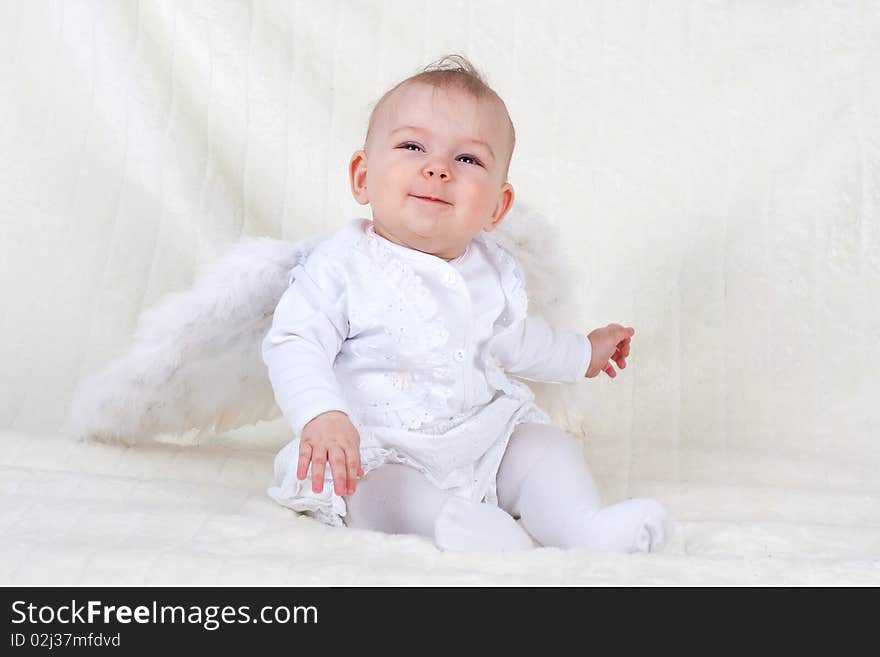 Happy child with wing at studio