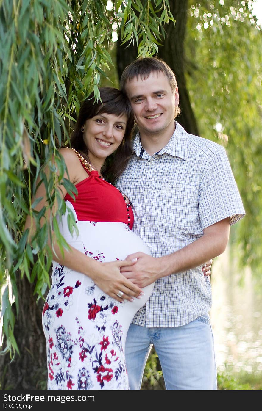 Happy pregnant woman with husband. Happy pregnant woman with husband