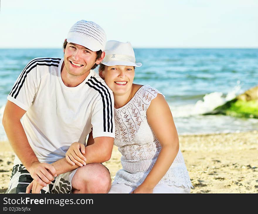 Happy couple on the sea beach