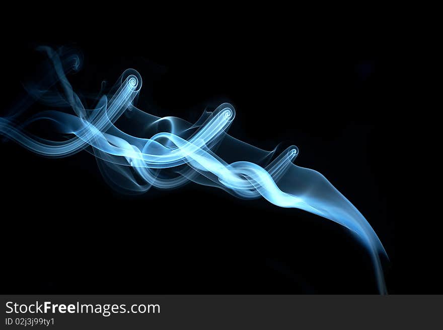 Blue smoke on black background