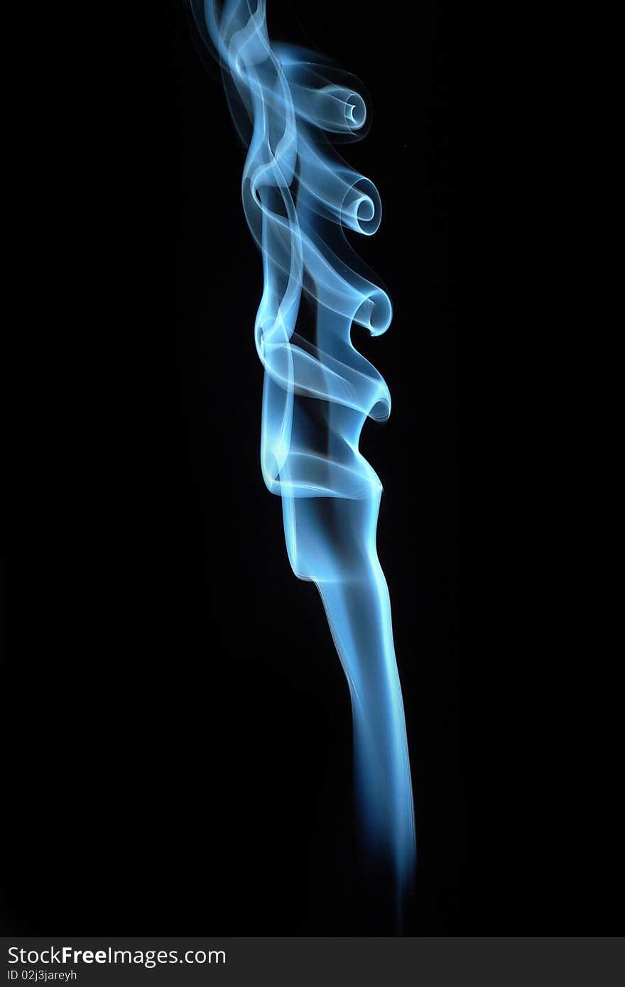 Blue curly smoke on black background. Blue curly smoke on black background