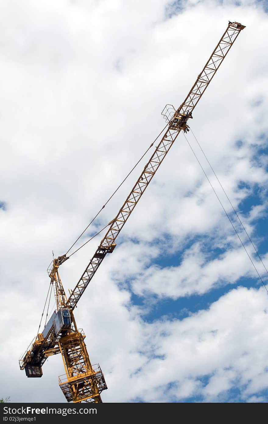 The crane in the blue sky. The crane in the blue sky