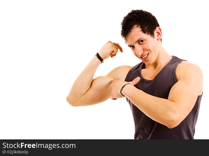 Young atletic man showing biceps, on white background