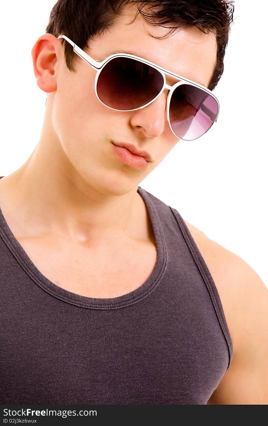 Portrait of stylished young man wearing sunglasses on white background