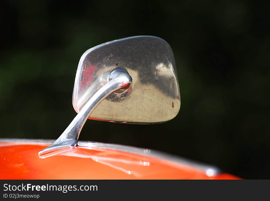 An old veteran car is his chromium-plated mirror. An old veteran car is his chromium-plated mirror.