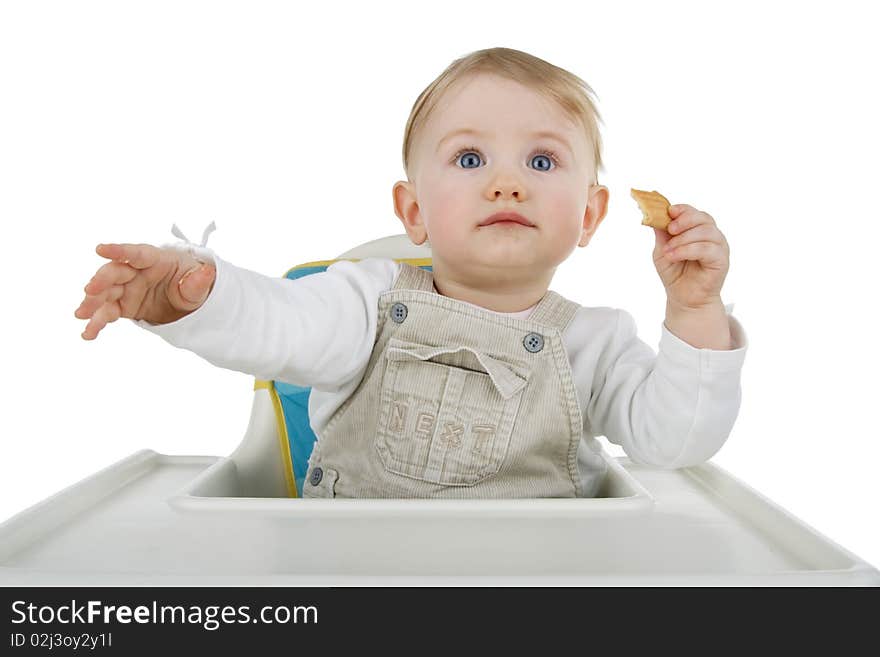 Infant biscuit on child's stool on egg white background. Infant biscuit on child's stool on egg white background.